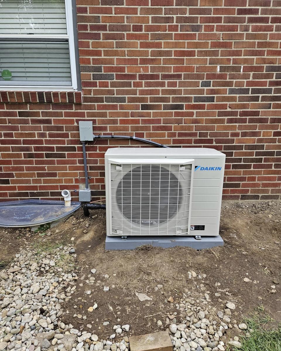 Ductless mini split outdoor unit on a new pad
